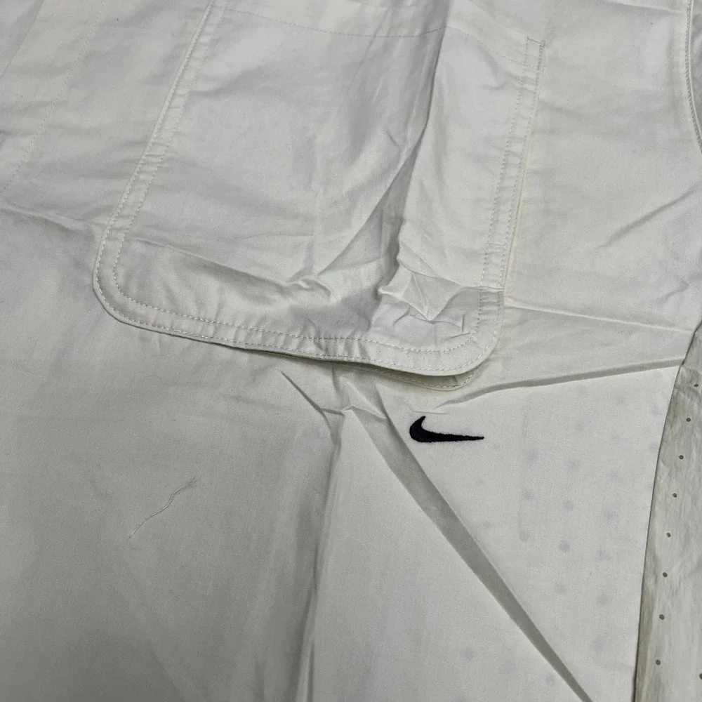 Nike tech button